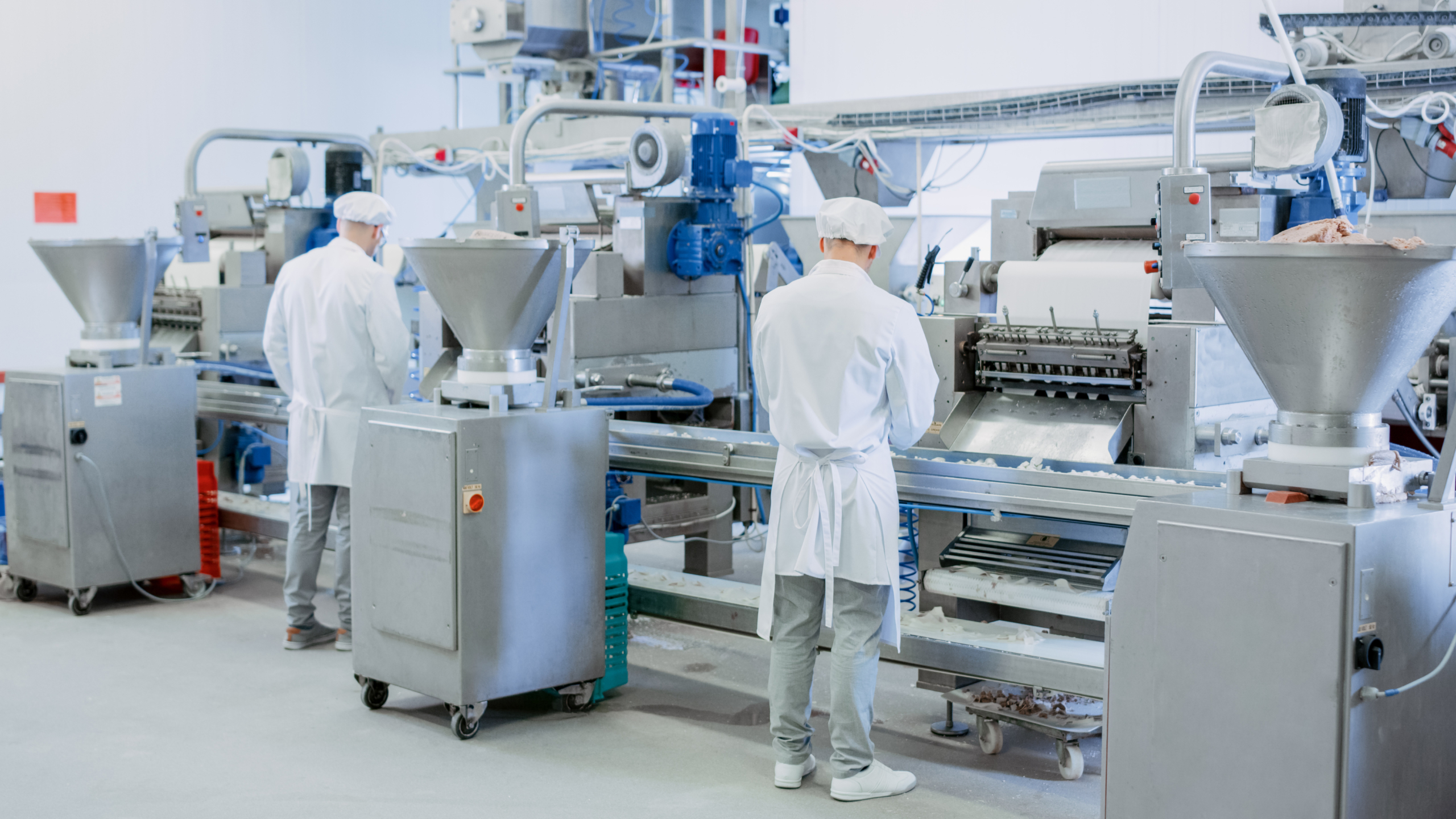 Chemical Management – factory line – protective wear – multiple workers